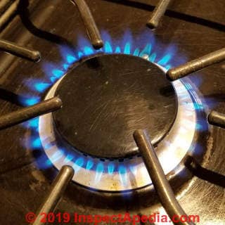 Gas  burner flame lifting off of or too far from burner orifices - high pressure (C) Daniel Friedman at InspectApedia.com