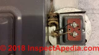 Low voltage transformer powering a doorbell (C) Daniel Friedman at InspectApedia.com