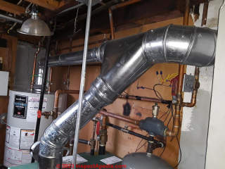 chimney backdrafting and installation (C) InspectApedia.com Margaret