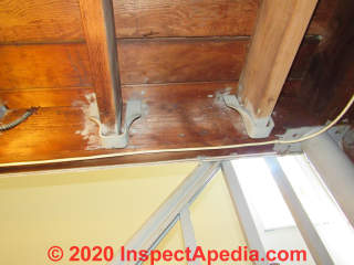 Joist hanger that does not permit structural nails or screws for connection - top-hung on ledger (C) InspectApedia.com DovBer Kahn home inspections