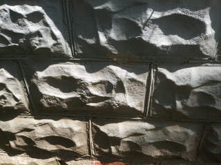 Decorative stone-faced concrete block foundation age (C) InspectApedia.com  XC