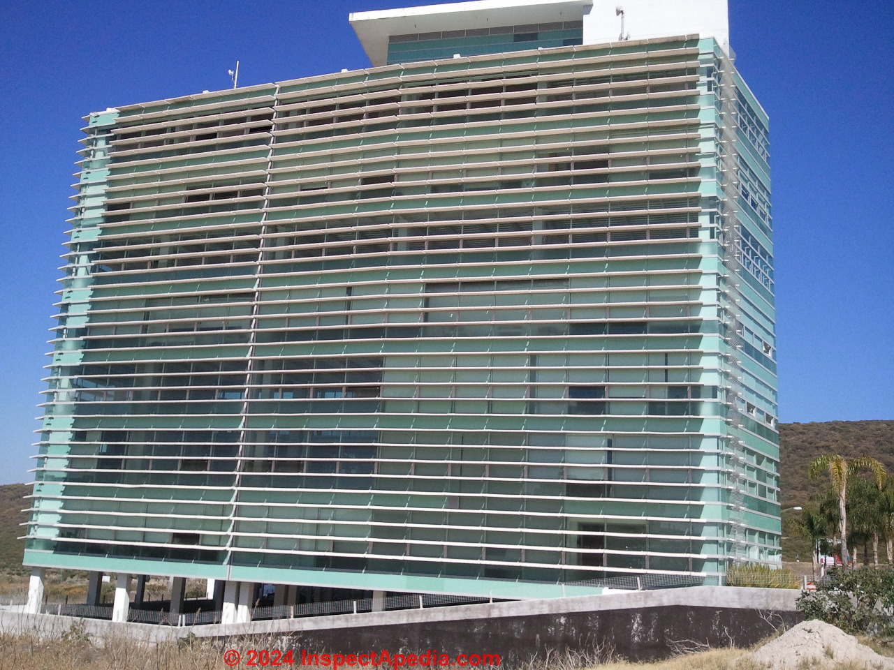 Solar shading on an office building in Queretaro, Mexico (C) Daniel Friedman at InspectApedia.com