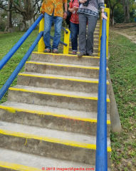 Yellow stripe added to the front of otherwise uniform-colored concrete steps can reduce trip hazards (C) Daniel Friedman at InspectApedia.com Yaxchilan