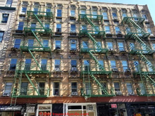 Fire escapes on a New York City Building (C) Daniel Friedman at InspectApedia.com