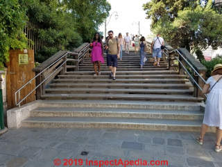 Wide stairway with side-handrails only at Campo San Stefano, Venice, Italy (C) Daniel Friedman at InspectApedia.com 
