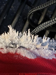 Crystalline growth on roadside emergency bag in under a vehicle seat (C) InspectApedia.com anonymouys reader