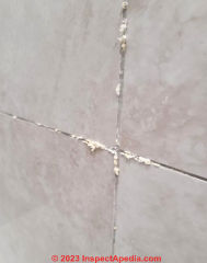 leak behind tile in shower (C) InspectApedia.com Dave
