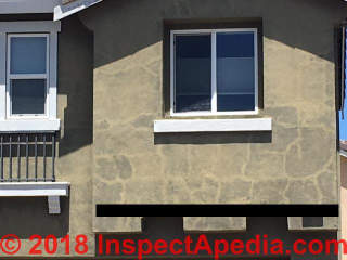 Stains following hairline cracks in exterior stucco (C) InspectApedia.com Jay