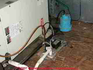 Photograph of  improper condensate drain connected to plumbing vent line