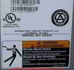 Photograph of the safety stickers on a residential air conditioning system