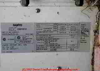 Photograph of an air conditioning system data tag or sticker showing the manufacturer's specifications