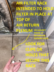 Wire rack intended to hold air filter in place at top of return air plenum in bottom of air handler (C) InspectApedia.com Katelyn