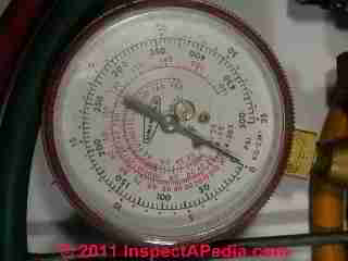 Photograph of a
commercial air conditioning compressor charging gauge set (C) InspectAPedia.com