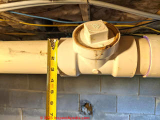 Condensation drain into septic system (C) InspectApedia.com BigRich