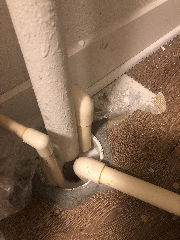 Air conditioning condensate drains over an open sewer pipe or drain - unsafe? (C) Inspectapedia.com MD