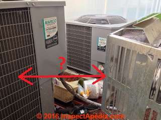 Gas fireplace vent too close to air conditioner compressor/condenser unit (C) InspectAPedia.com