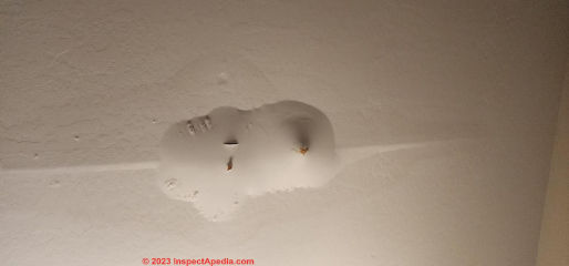 Leak bubble in ceiling, may be due to air conditioner condensate leak (C) Freedom at InspectApedia.com