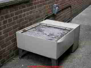 Photograph of  This old compressor was used as a seat by workers eating lunch behind
a law office.