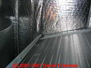 Photo of foil covered fiberglass insulation inside an HVAC air handler (C) Daniel Friedman