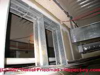 Photograph of commercial air conditioning system ceiling plenum with debris