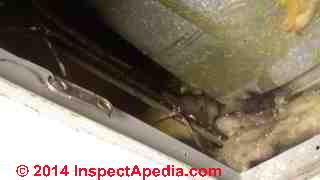 Fiberglass-lined HVAC ducts badly damaged by mechanical duct cleaning (C) InspectAPedia.com