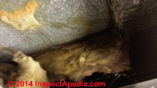 Fiberglass-lined HVAC ducts badly damaged by mechanical duct cleaning (C) InspectAPedia.com