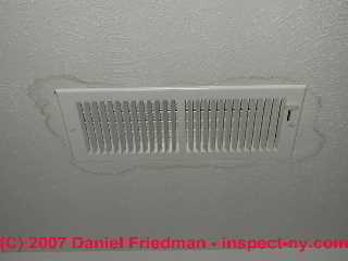 Leak stains around an air conditioning ceiling register (C) Daniel Friedman