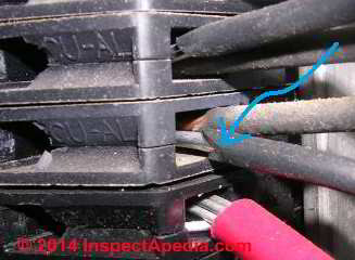 Double tapped aluminum and copper wire in a CUAL breaker (C) InspectApedia