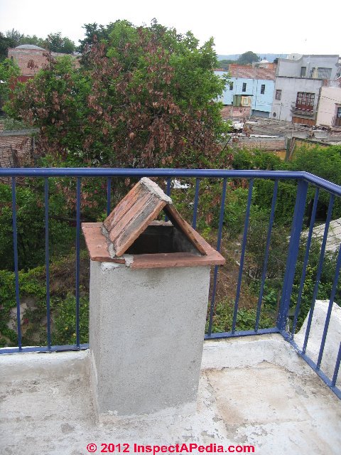 Brick chimney rain cap and cap - San Miguel de Allende, Mexico (C) Daniel Friedman