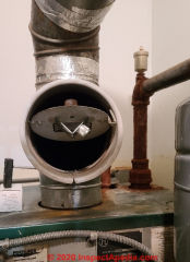 Draft regulator on a Peerless oil fired hydronic boiler tested by the author (C) Daniel Friedman at InspectApediaa.com