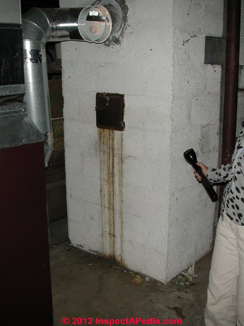 Water leak stains at the chimney cleanout door (C) Daniel Friedman