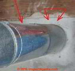 Inadequate fire clearance for oil fired heater flue vent connector (C) InspectApedia.com