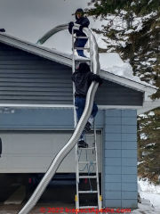 Stainless chimney liner is brought to the rooftop for insertion into the flue (C) InspectApedia.com A Church