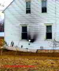 Unsafe through-wall side wall vent chimney © D Friedman at InspectApedia.com 