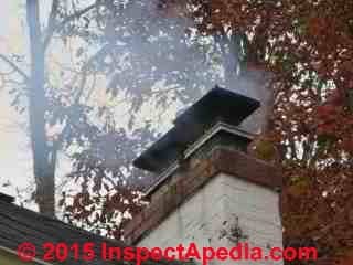 Smoky oil burner chimney and close-flues at same height (C) Daniel Friedman