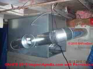 Galvanized steel flue vent connector on an oil fired heater with unsafe fire clearances to wood framing (C) InspectApedia.com NH Firebear