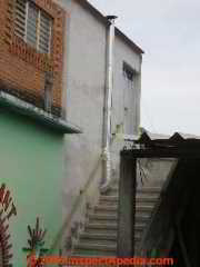 Single wall metal flue interrupted by handrailing (C) Daniel Friedman Oxaca Mexico