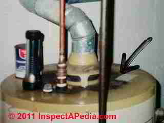 Flue gas spillage at gas fired hot water cylinder (C) Daniel Friedman at InspectApedia.com