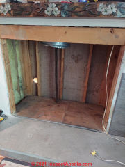 Opening for zero clearance fireplace in a wood framed chimney chase (C) InspectApedia.com leddyhonda