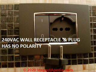 Non-polarized 240VAC line voltage cord plug and wall receptacle in Venice, Italy (C) Daniel Friedman at InspectApedia.com