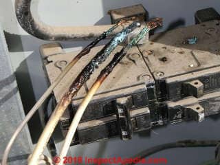 Burned electrical wires are unsafe; the cause must be found and fixed (C) InspectApedia.com