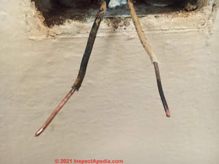 Burned neutral wire at receptaacle (C) InspectApedia.com John S
