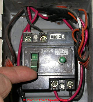 Main circuit breaker in the OFF or "NO" position in a Buenos Aires panel (C) Daniel Friedman at InspectApedia.com