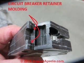 Circuit breaker retainer molding detal shows how the breaker is retained in the electrical panel (C) Daniel Friedman at InspectApedia.com
