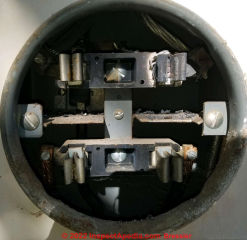 Electric meter wiring overheats, shorts, burns, damages Zinsco panel - (C) InspectApedia.com Bressler
