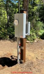 outdoor freestanding electrical service panel (C) InspectApedia.com Dean