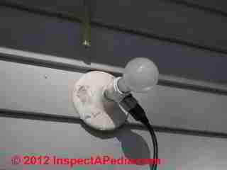 Unsafe outdoor lighting © D Friedman at InspectApedia.com 