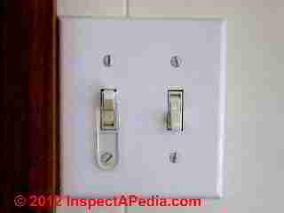 Light switch lock © D Friedman at InspectApedia.com 
