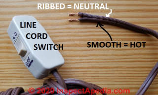 Ribbed side of line cord idenifies the neutral or 'white' or wide-plug-spade wire (C) Daniel Friedman at InspectApedia.com