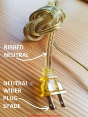 Ribbing on clear lamp cord wire insulation indicates the neutral wire (C) Daniel Friedman at InspectApedia.com